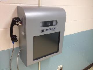 Photo of video viewing device (with screen) attached to a wall
